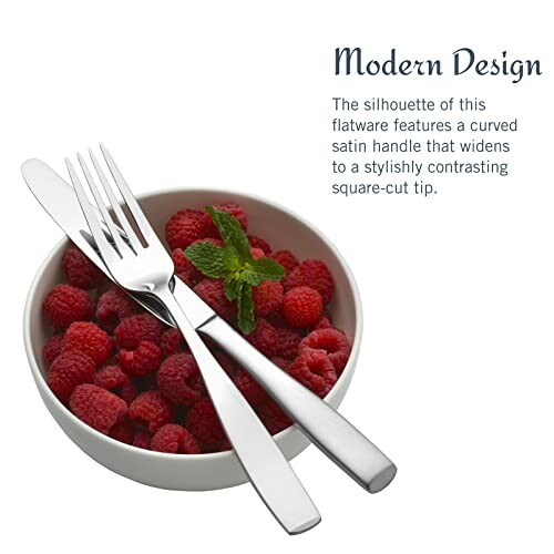 Bowl of raspberries with modern flatware design.