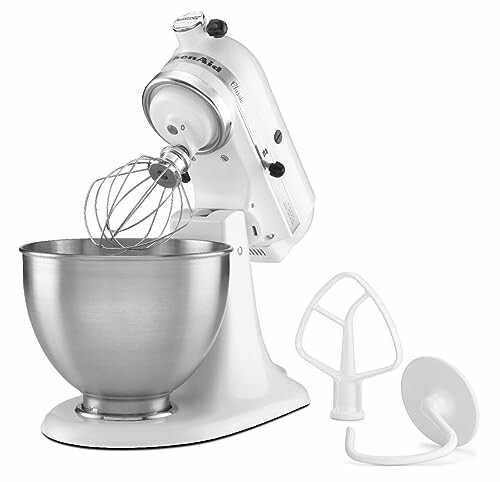 White stand mixer with mixing bowl and attachments.